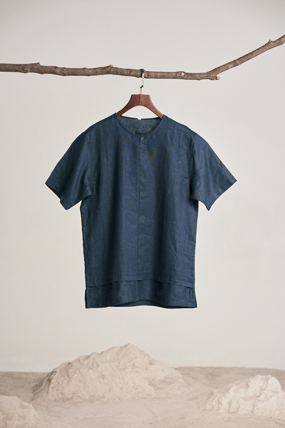 a blue shirt hanging on a clothes line