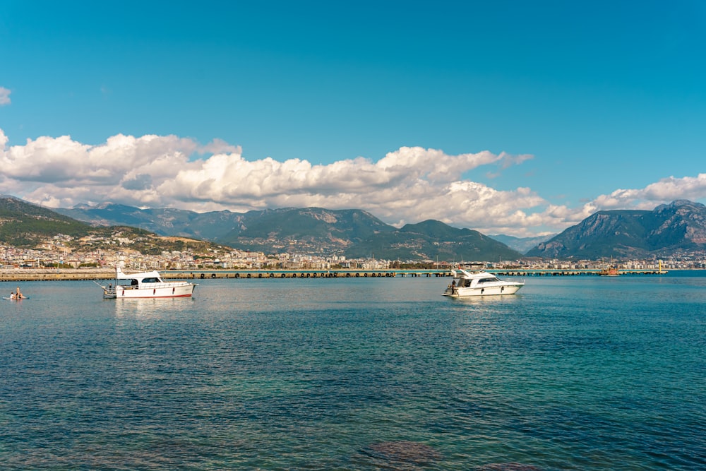 a group of boats floating on top of a large body of water