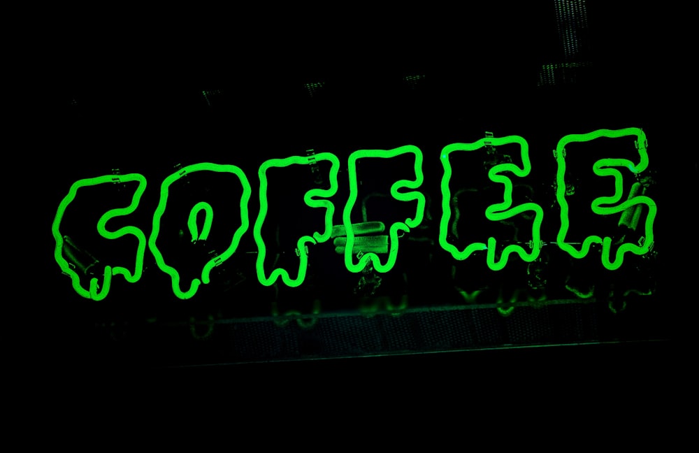 a neon sign that says coffee on it