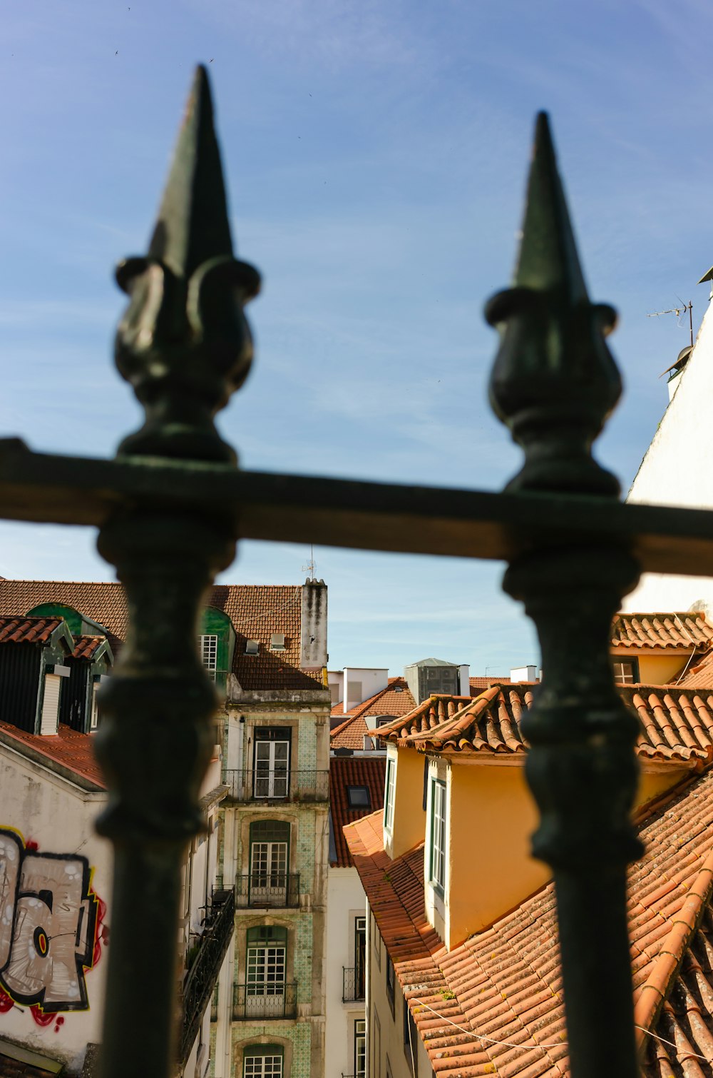 a view of a building through a fence