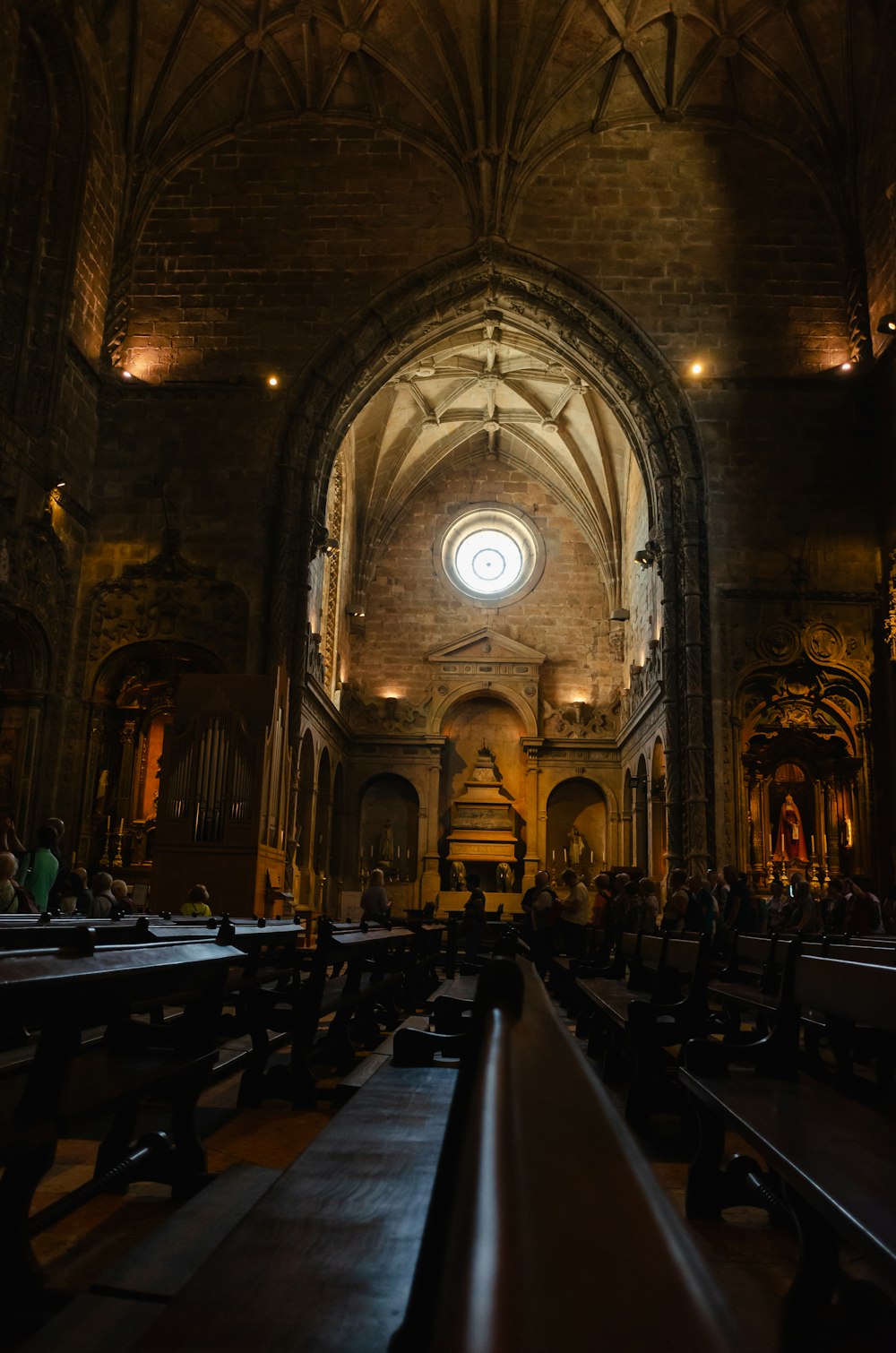 a church filled with pews and a large window