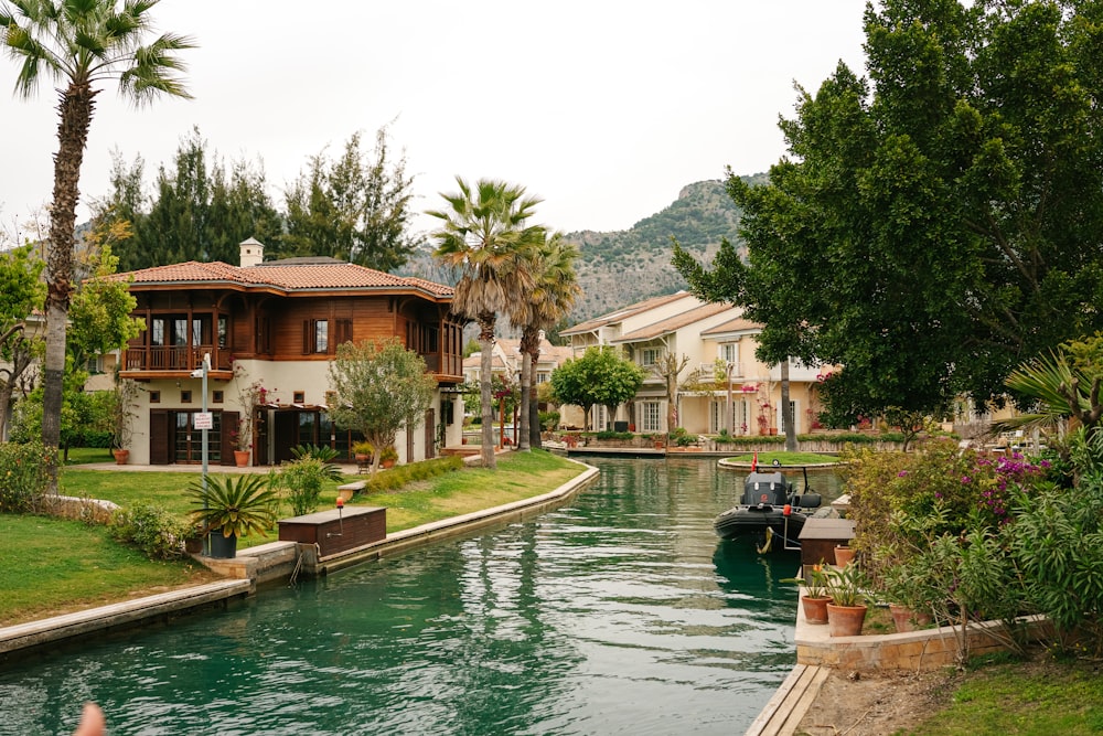 a canal runs through a residential area of a town