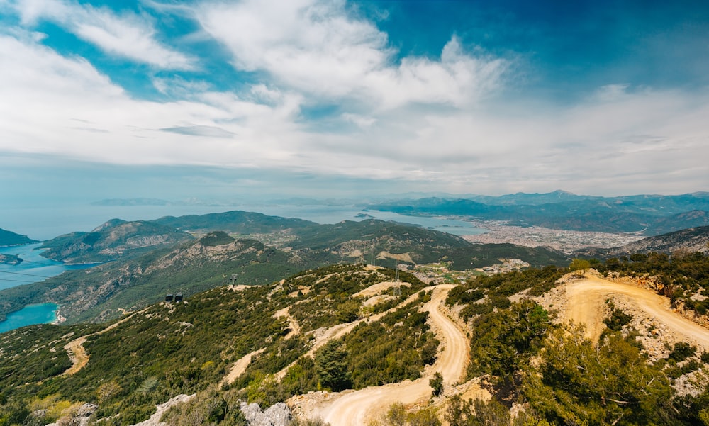 a view of a dirt road on top of a mountain