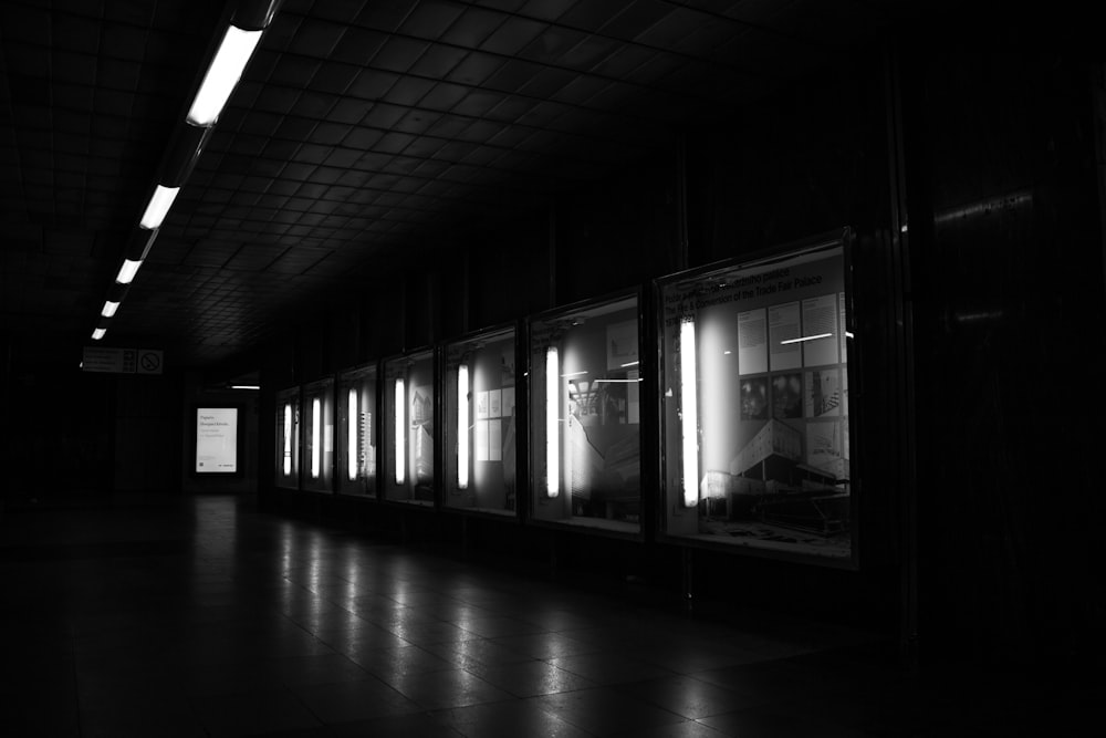 a black and white photo of a subway station