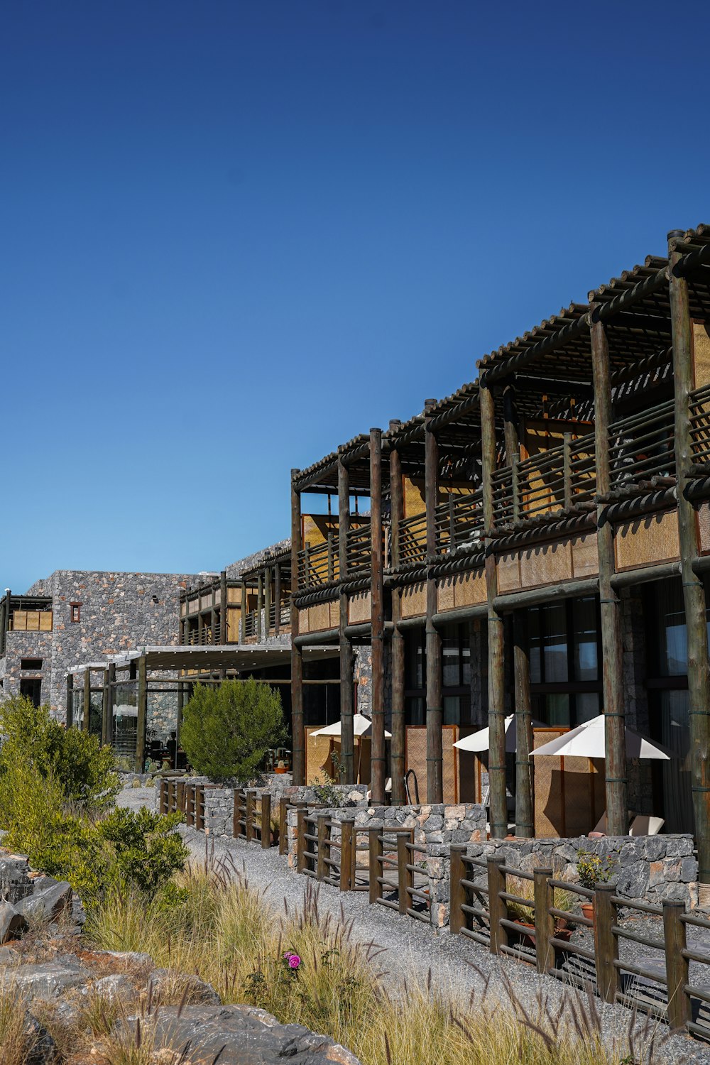 a row of wooden buildings sitting next to each other