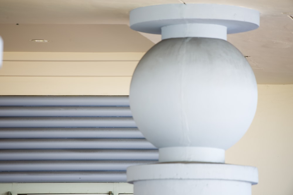 a close up of a light fixture on a ceiling