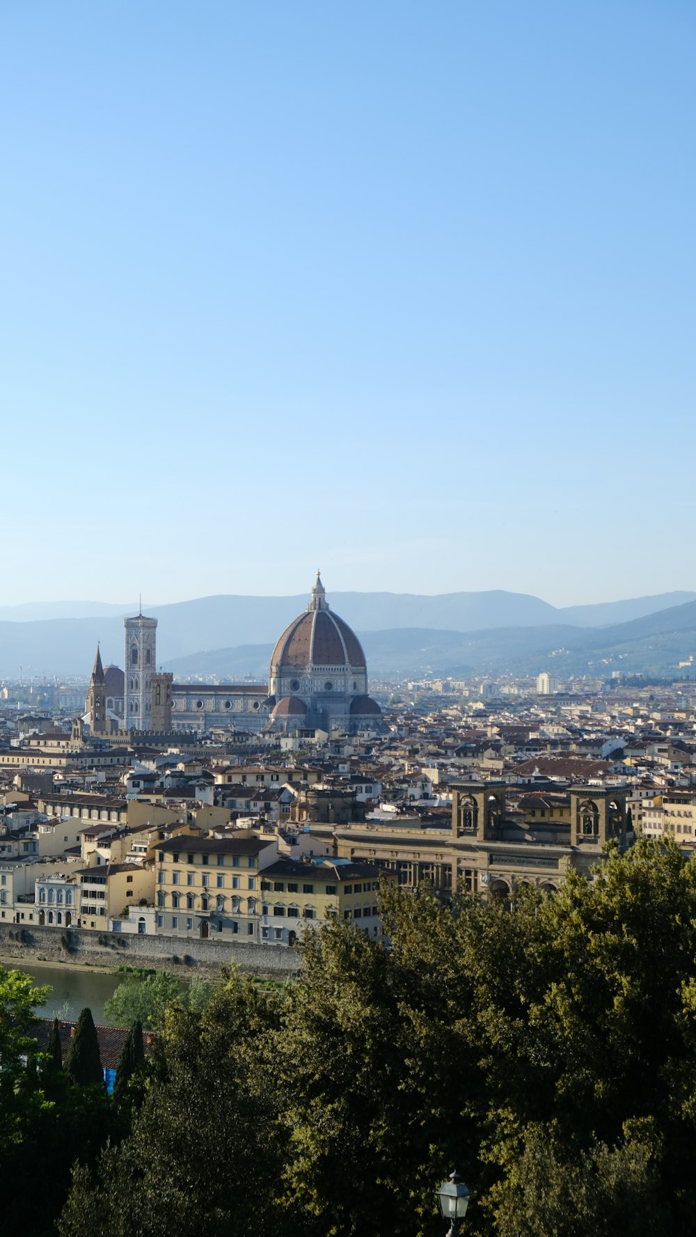 a view of a city from a hill