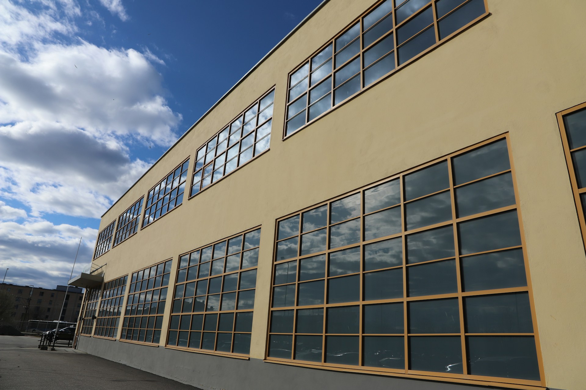 a building with many windows and a sky background