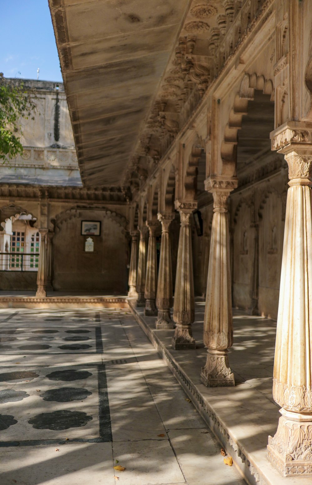 an old building with columns and a clock