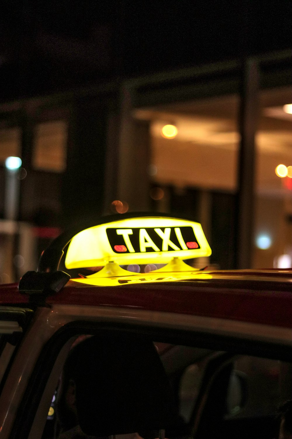 a taxi cab with a taxi sign on top of it