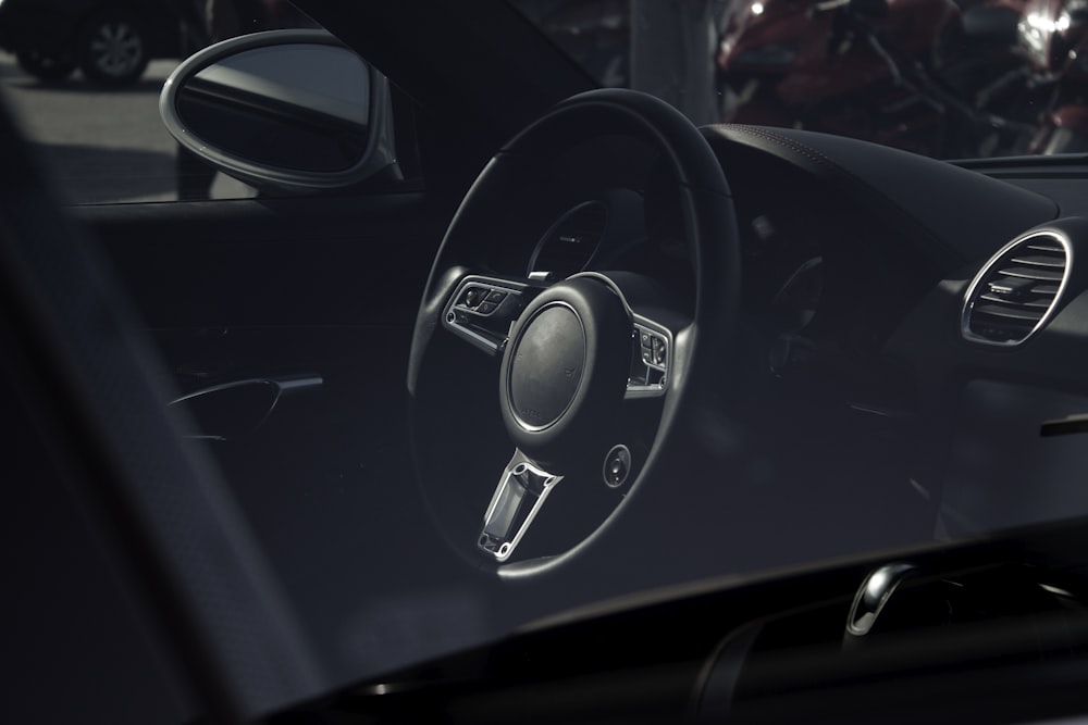 a close up of a steering wheel and dashboard of a car