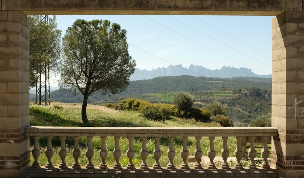 a view of a mountain range from a balcony