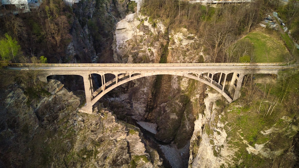 an aerial view of a bridge over a canyon