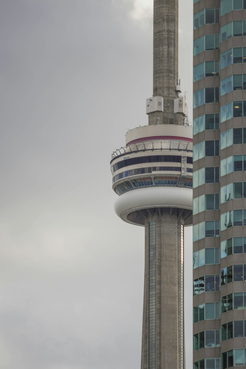 a very tall building with a very tall tower in the background