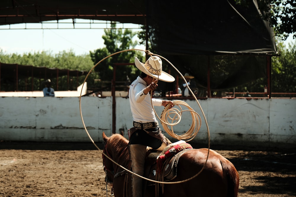 a man on a horse with a lasso