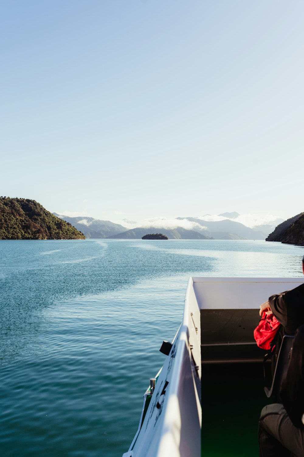 a person sitting on a boat in the water