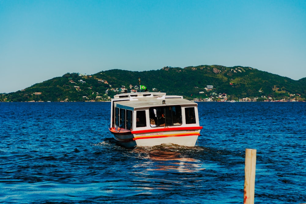 a small boat in the middle of a body of water