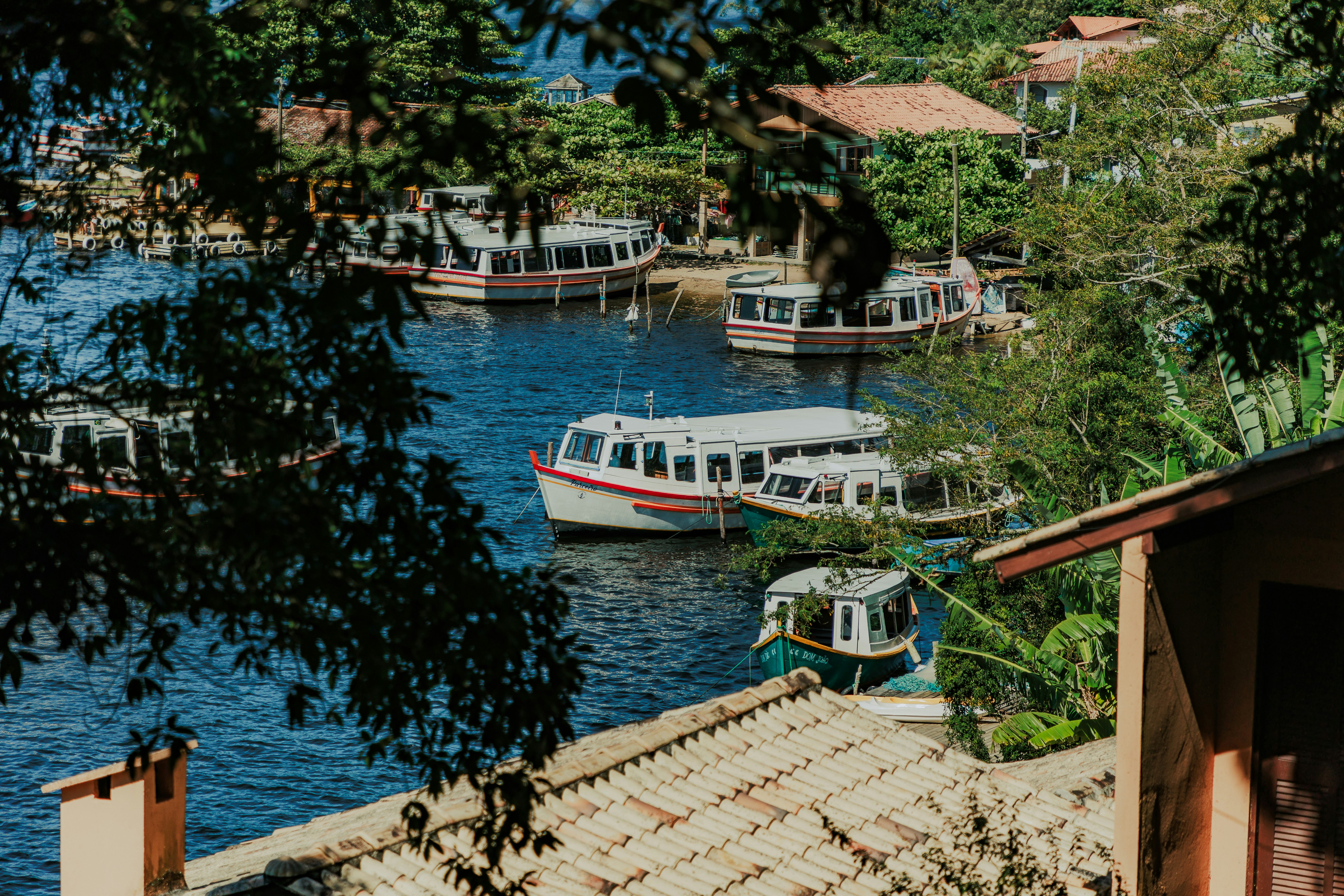 a group of boats floating on top of a river