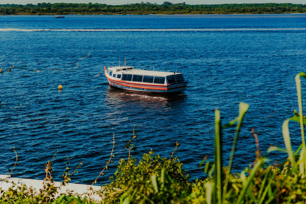 a boat floating on top of a large body of water