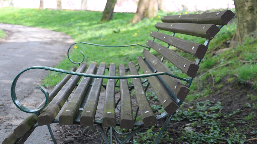 a park bench sitting in the middle of a park