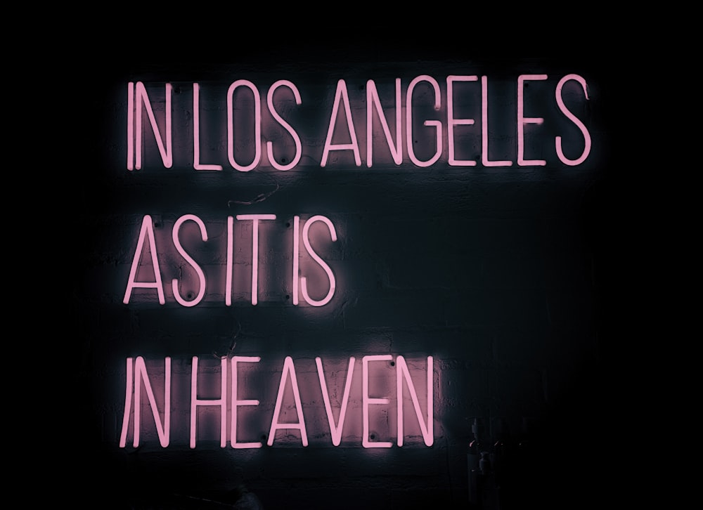 a neon sign that says in los angeles as it is in heaven