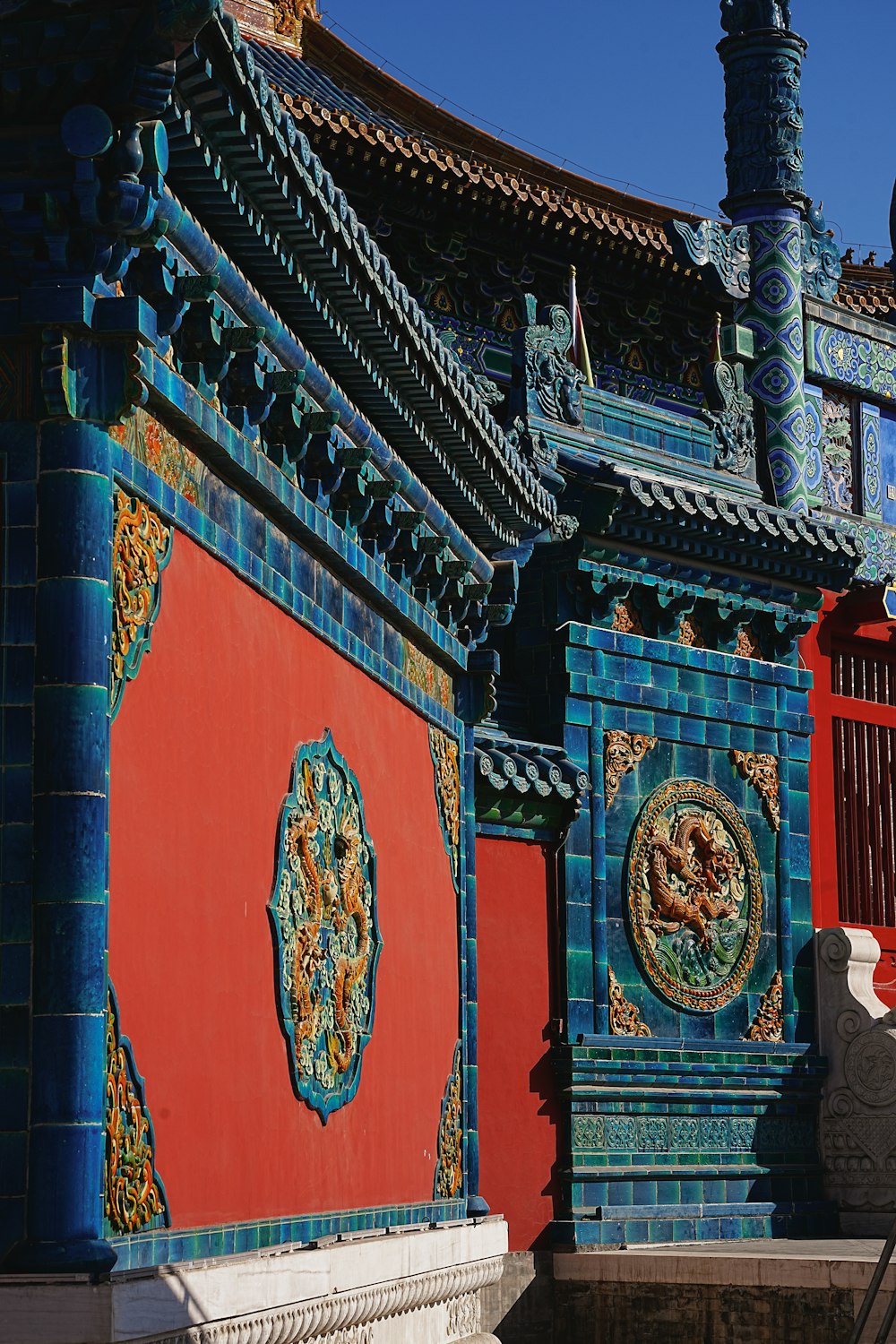 a colorful building with a clock on the side of it