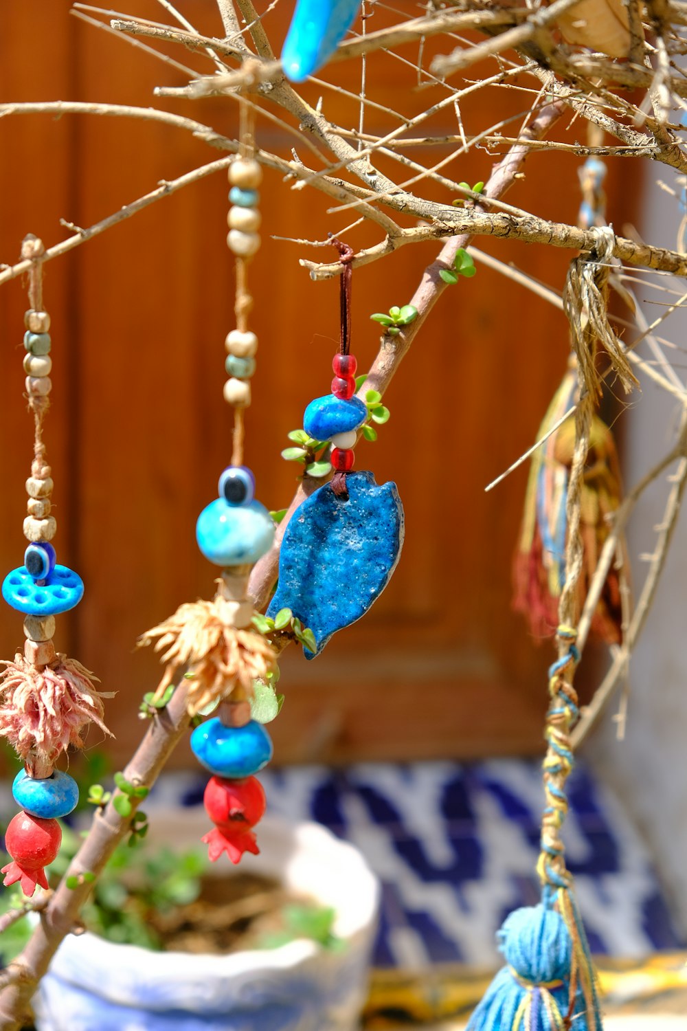 a tree with a bunch of beads hanging from it's branches