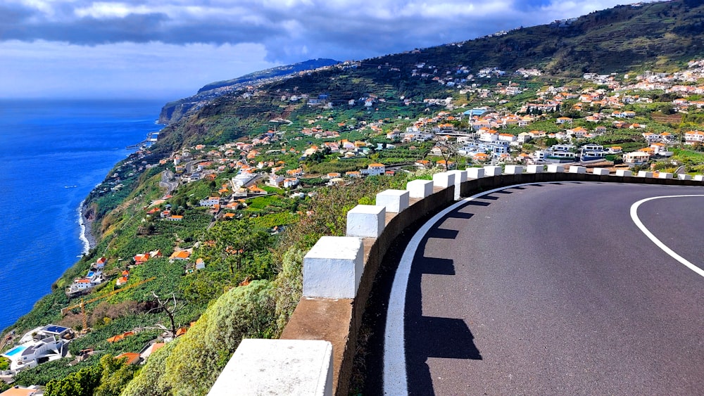 a winding road with a view of the ocean