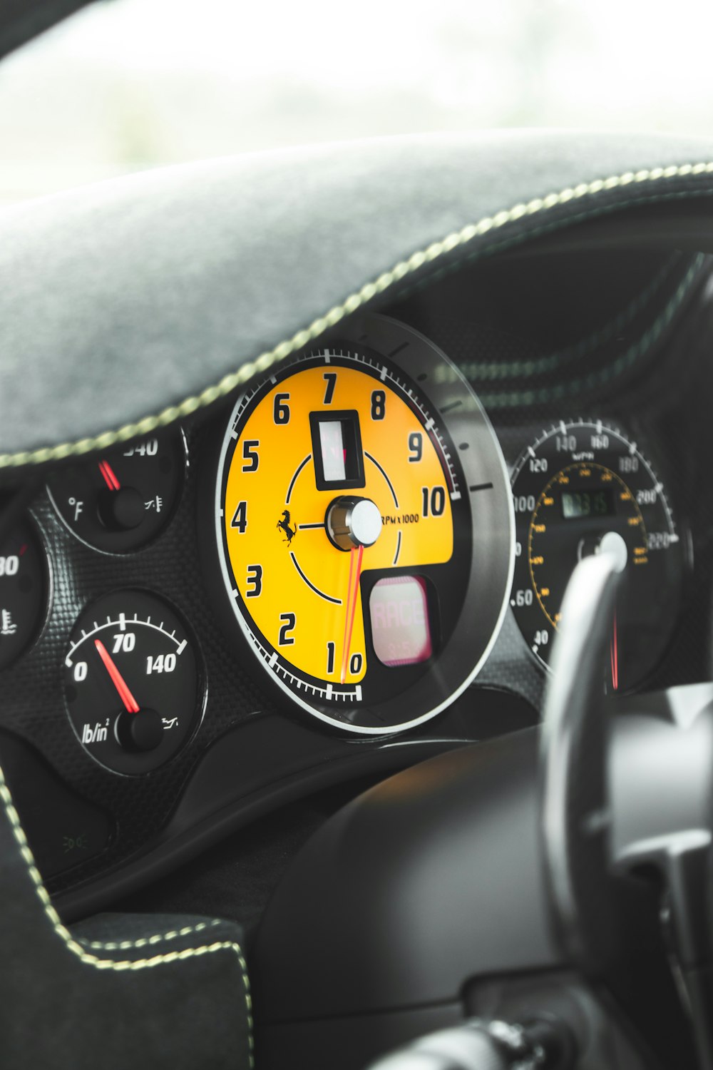 a close up of a car dashboard with a speedometer