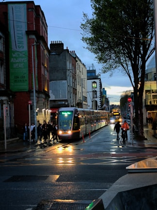 a city street with a train on the tracks
