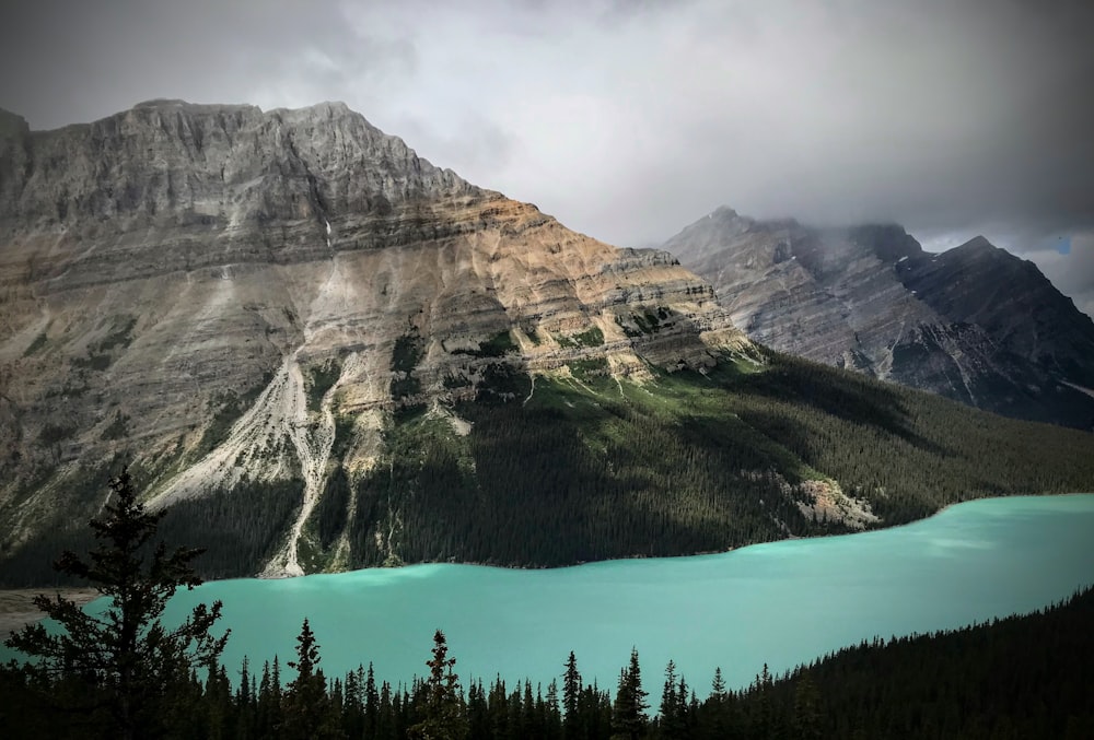 a large mountain with a lake in the middle of it