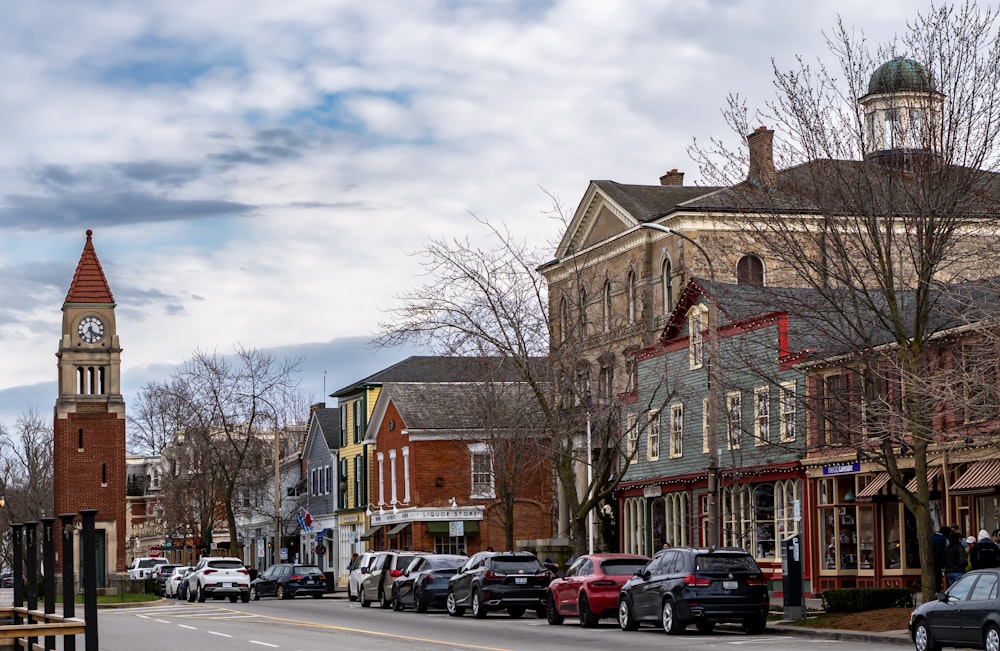 a city street with a clock tower in the background