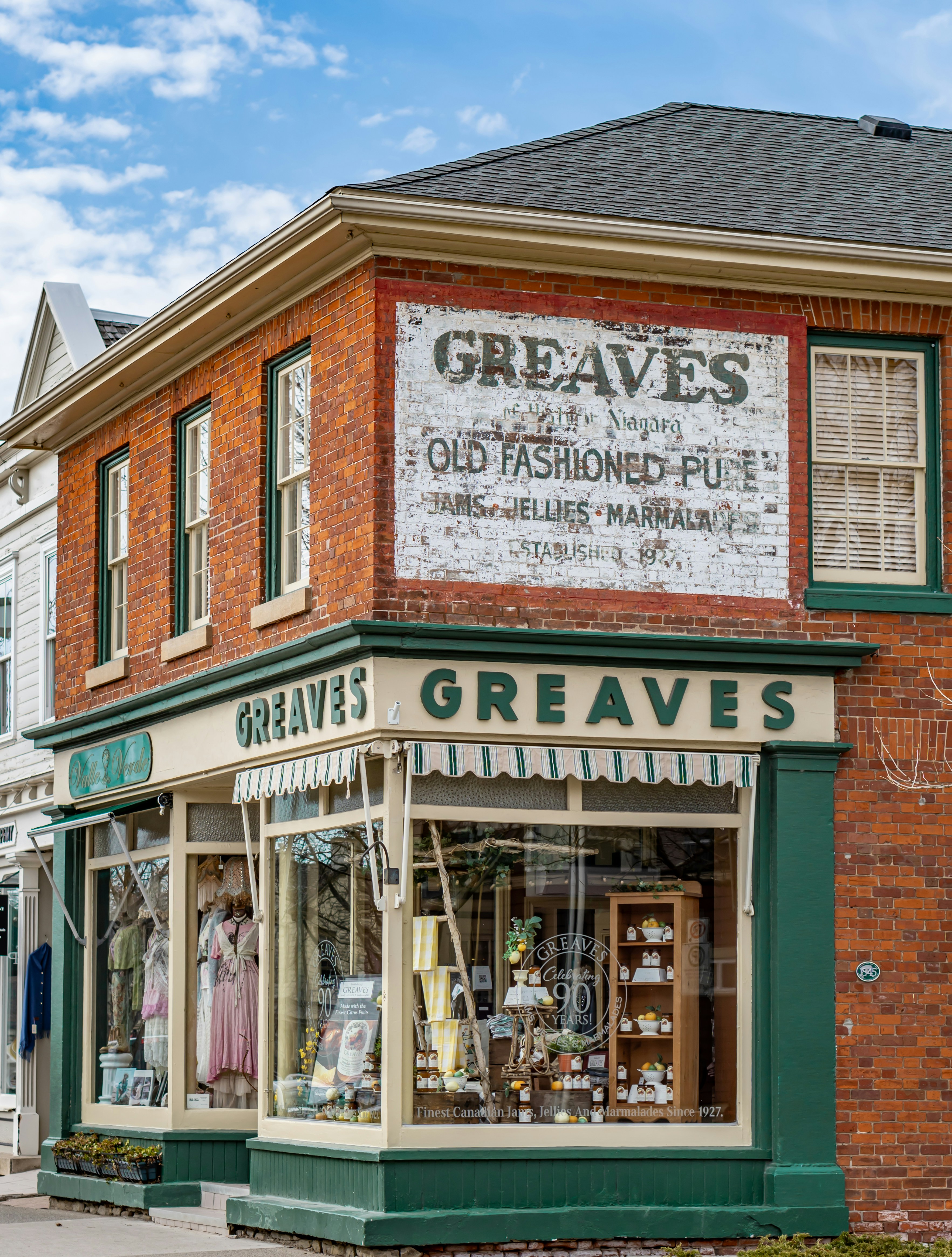 an old fashion store on the corner of a street