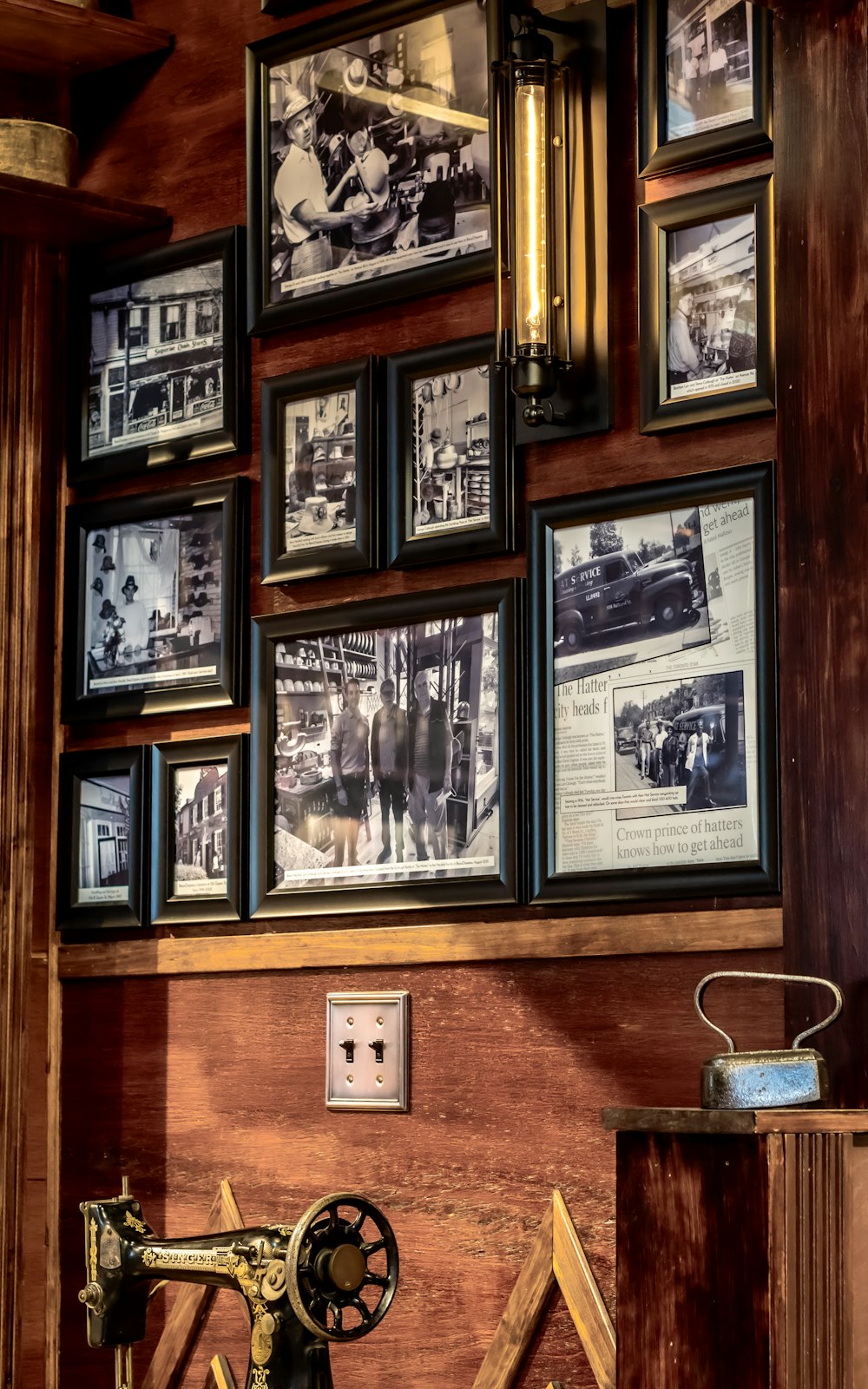 a wall with pictures and a sewing machine