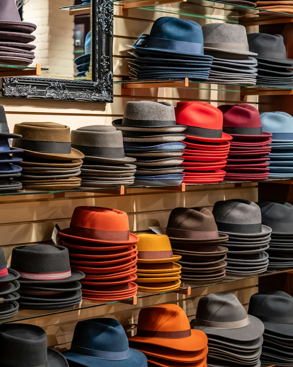 many hats are on display in a store