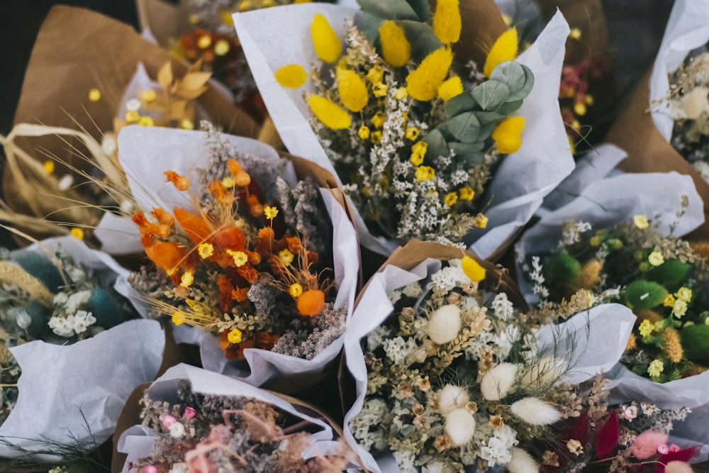 a bunch of flowers that are sitting on a table