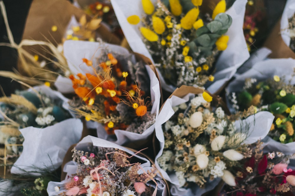 a bunch of flowers that are sitting on a table