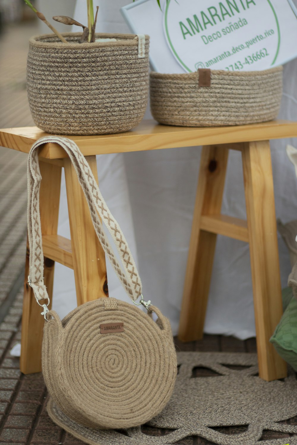 a table with two baskets and a purse on it