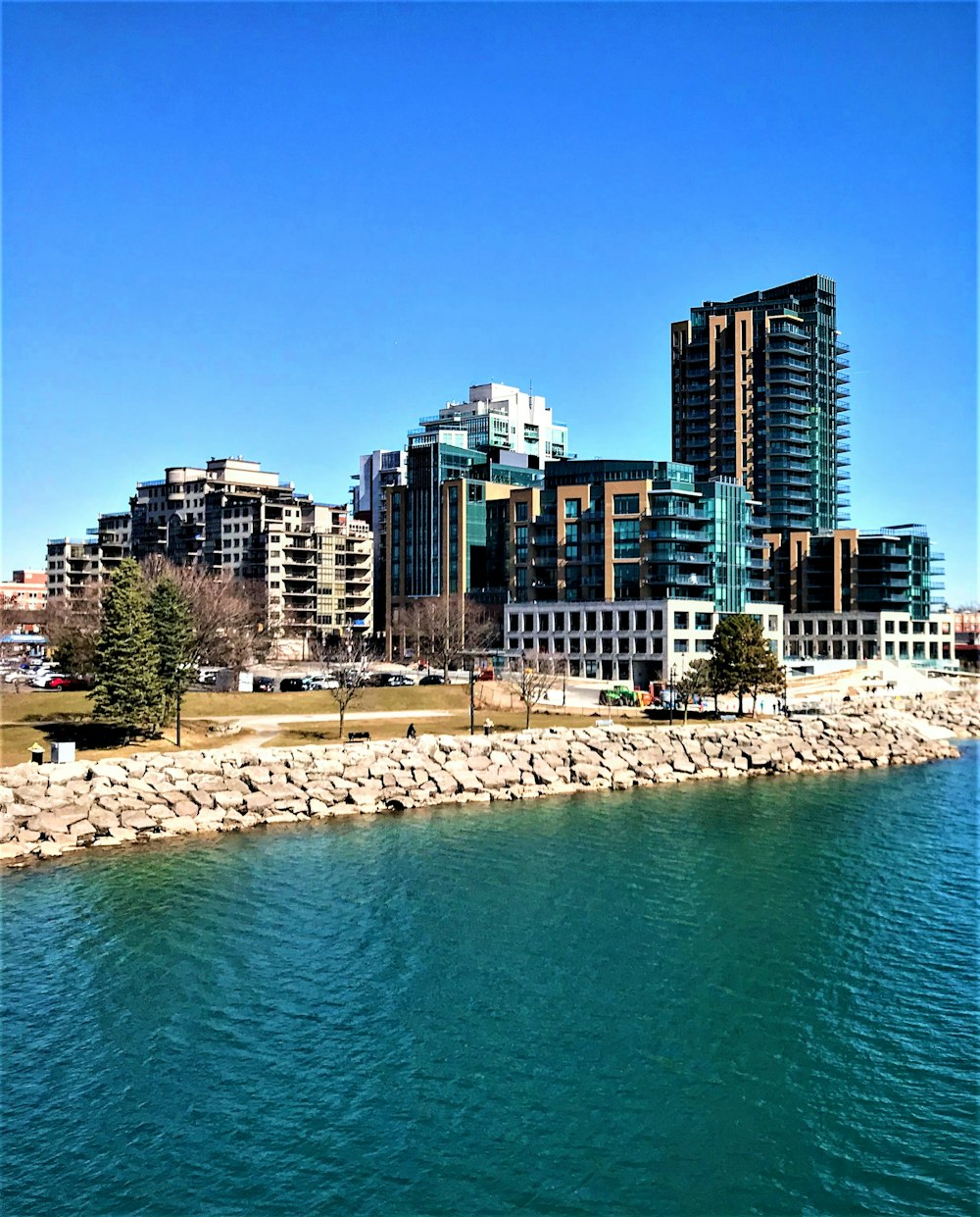 a large body of water with a city in the background