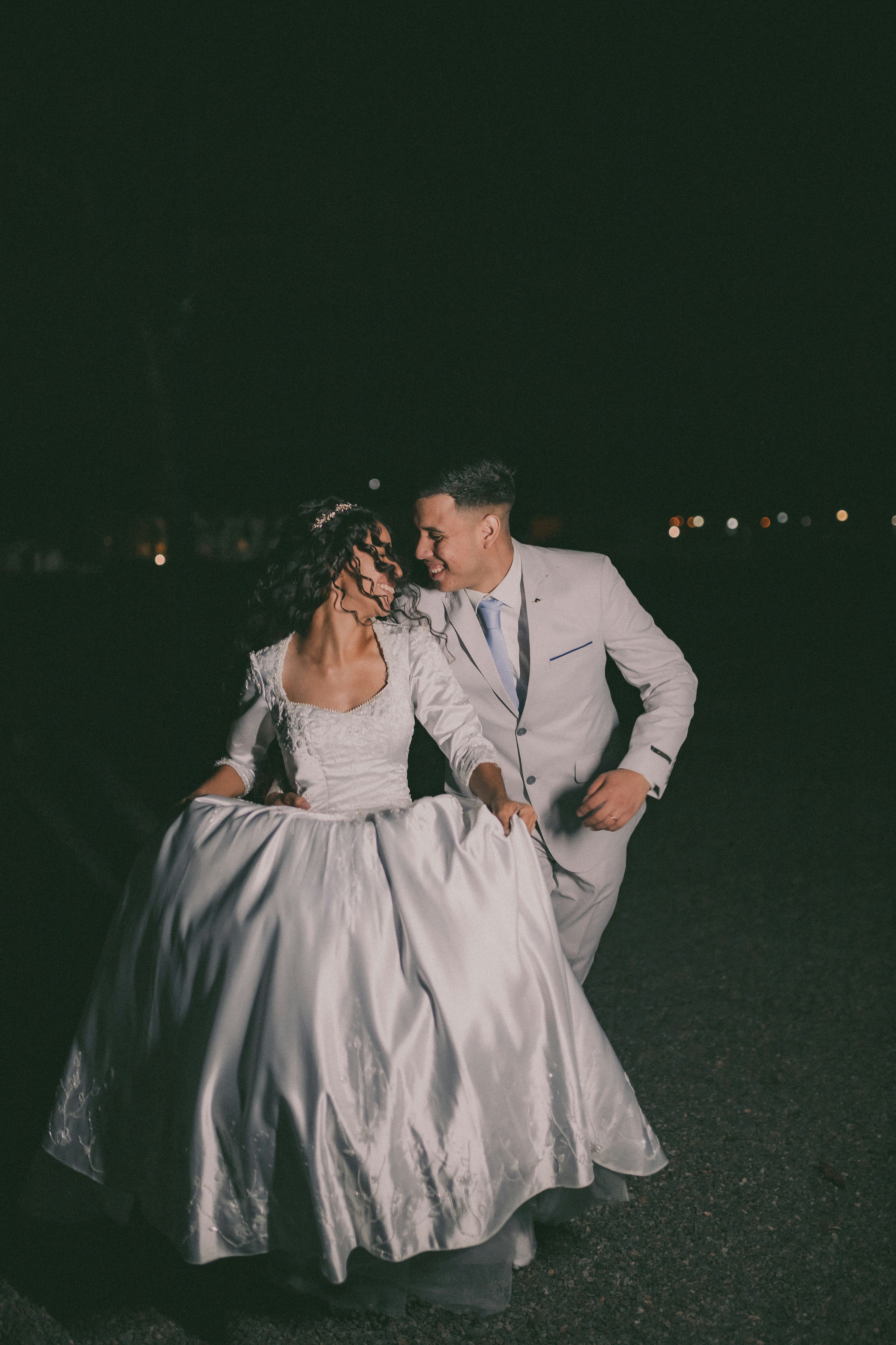 a man and a woman dressed in wedding attire