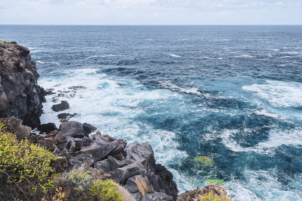 a view of the ocean from a cliff