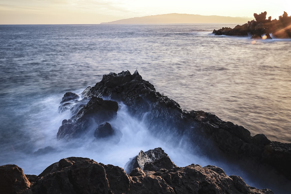 a large body of water surrounded by rocks