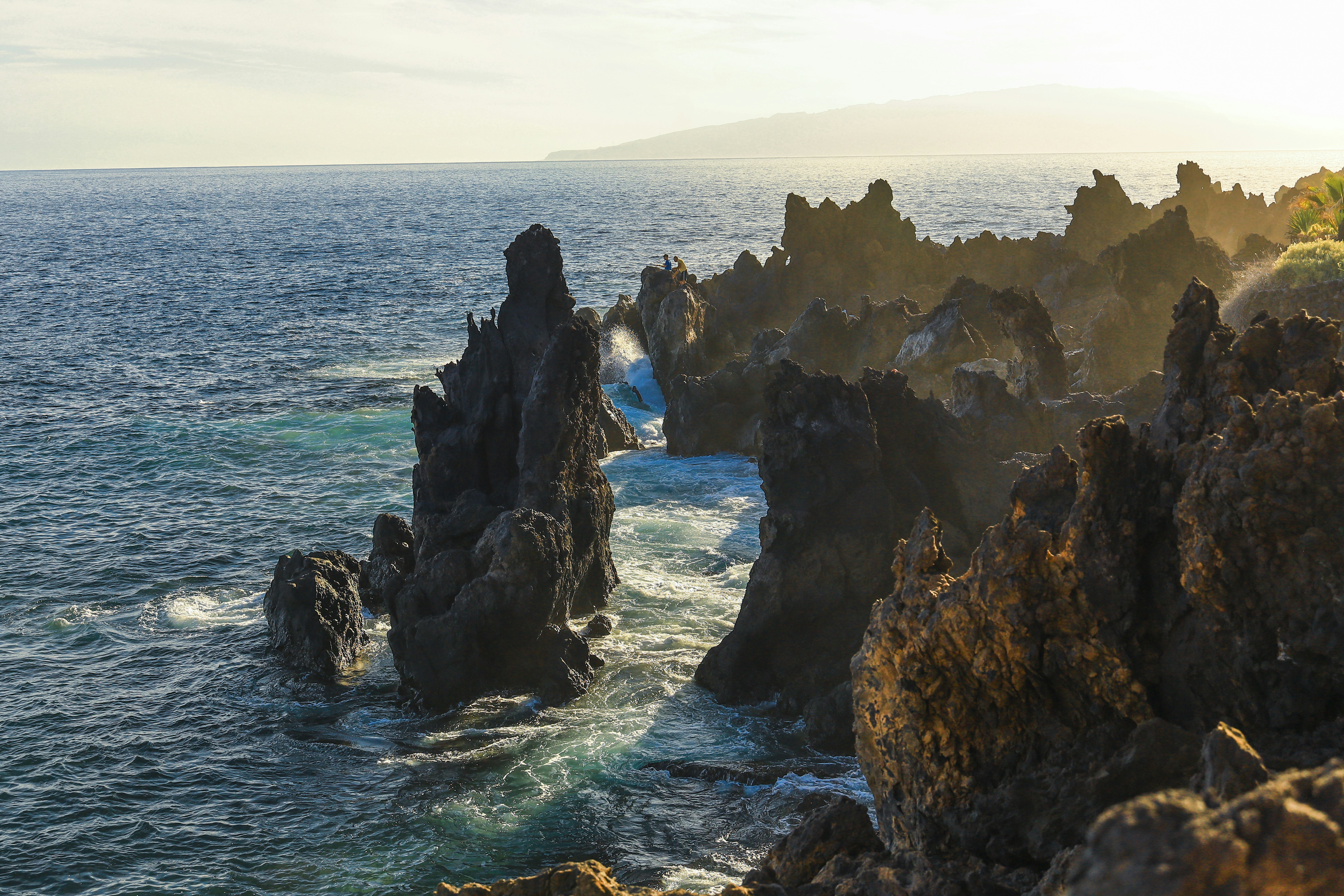a large body of water surrounded by rocks