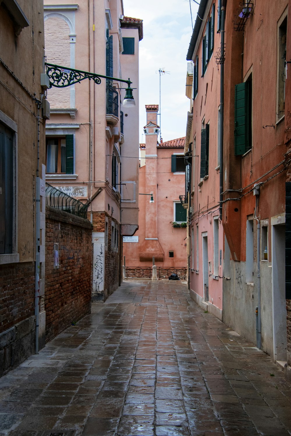 a narrow alleyway in an old european city