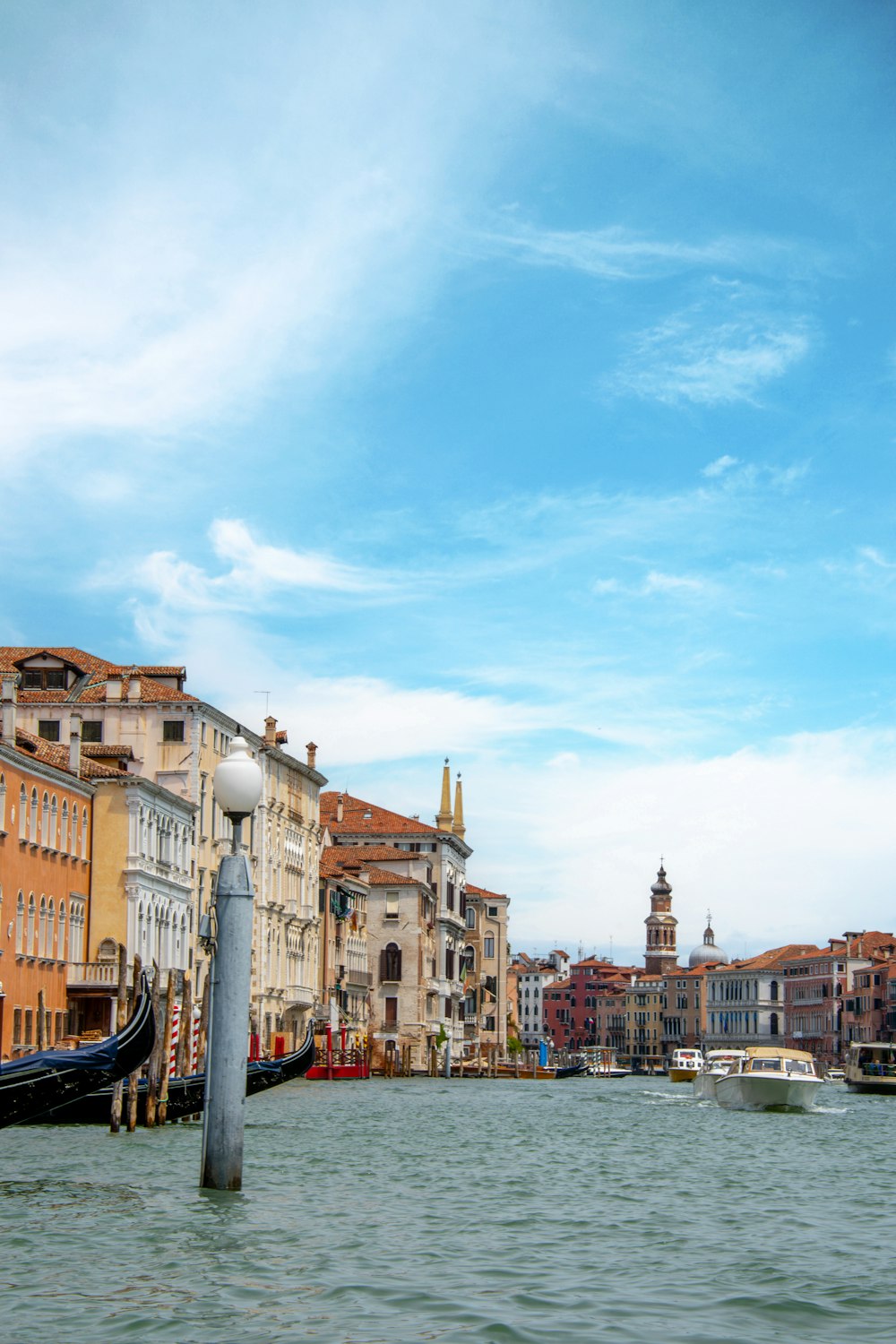 a view of a waterway with a gondola in the foreground