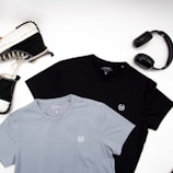 a pair of headphones, a pair of sneakers, and a t - shirt