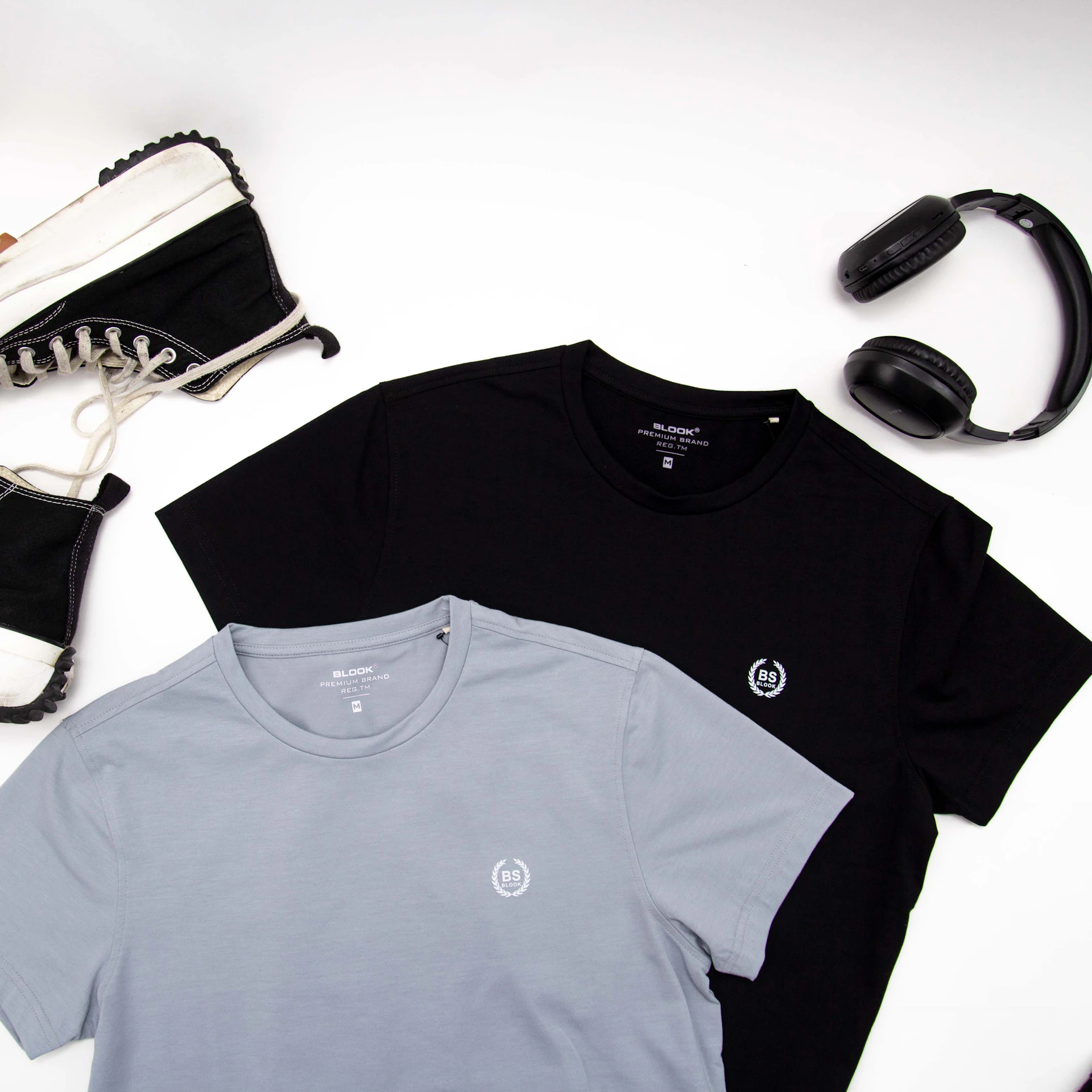 a pair of headphones, a pair of sneakers, and a t - shirt