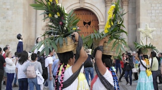 a couple of people that are holding some plants