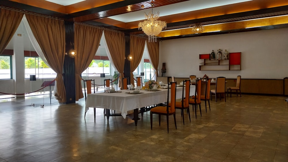 a dining room with a table and chairs