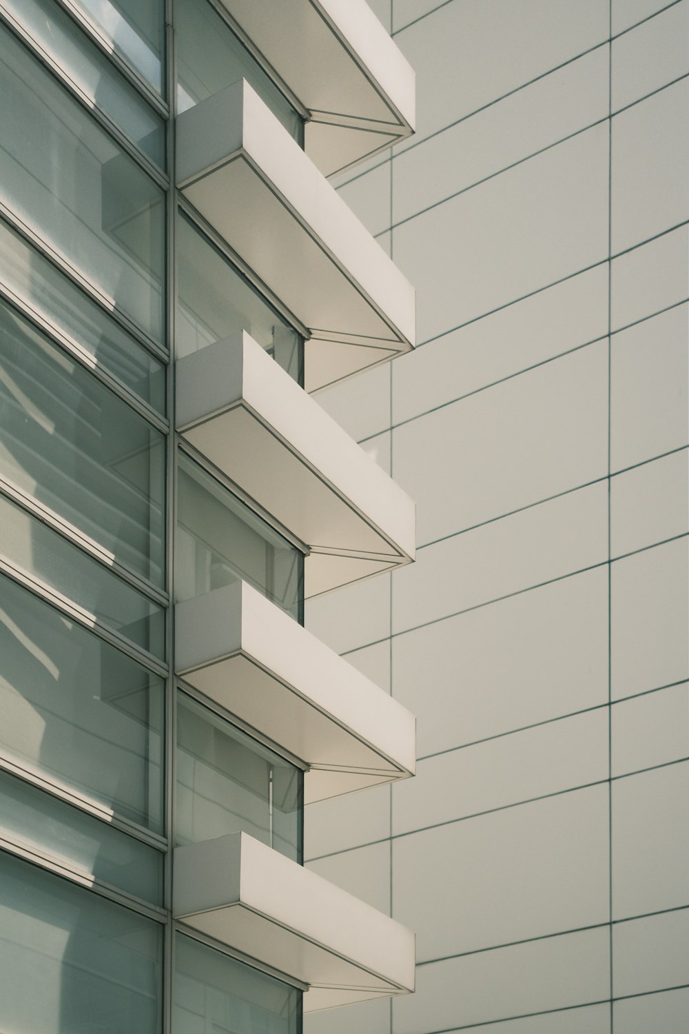 a tall building with lots of windows next to it